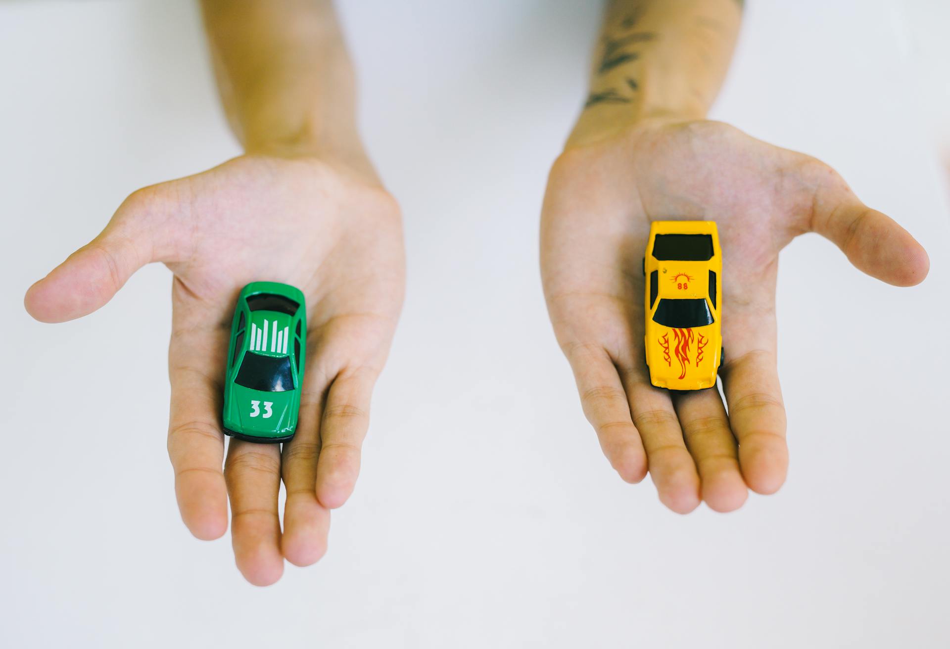 Car models showcase on both hands